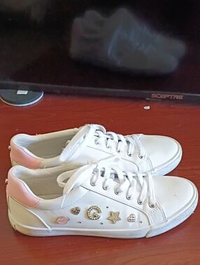 BCBG White Leather Sneakers with Pink Heel Accents and Gold Charms